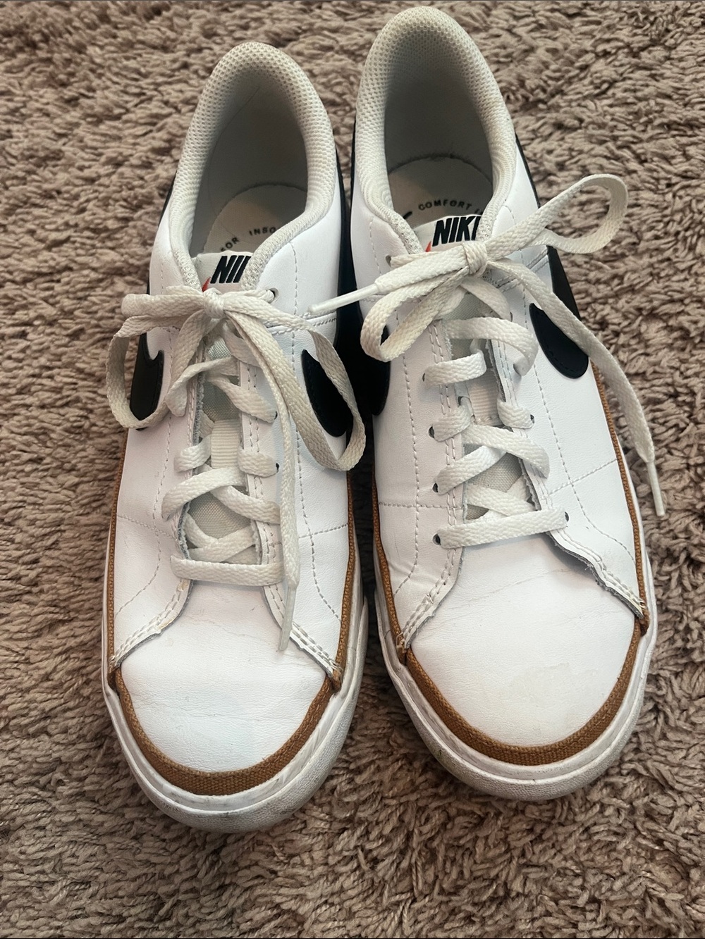 Nike White Leather Sneakers with Black Swoosh and Brown Trim
